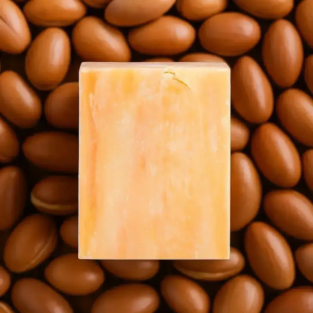 Facial Soaps Over Face Washes: Natural soap bar surrounded by brown nuts, representing benefits of facial cleansing.