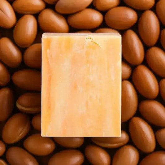 Facial Soaps Over Face Washes: Natural soap bar surrounded by brown nuts, representing benefits of facial cleansing.