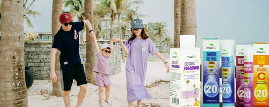 Family enjoying a beach day with immunity supplements UAE in the foreground, promoting winter wellness.