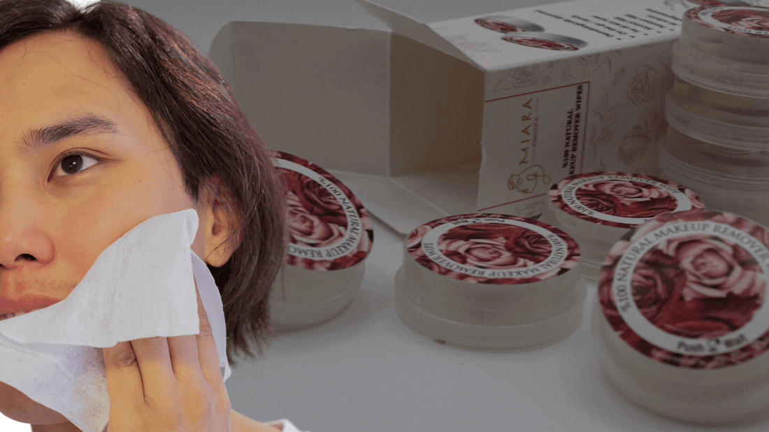 Person using Makeup Cleansing Wipes to remove makeup with product containers visible in the background.