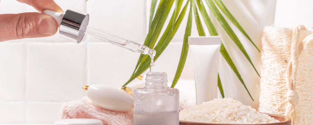 Dropping serum from a pipette into a bottle for Fermented Skincare for Sensitive Skin.