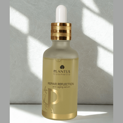 Plantus Cosmetic repair reflection anti aging serum bottle with dropper on a light background