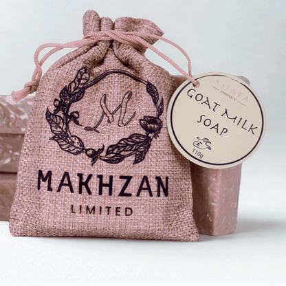 Miara Essence Goat milk natural soap with a decorative drawstring bag labeled 'Makhzan Limited' on a light background.