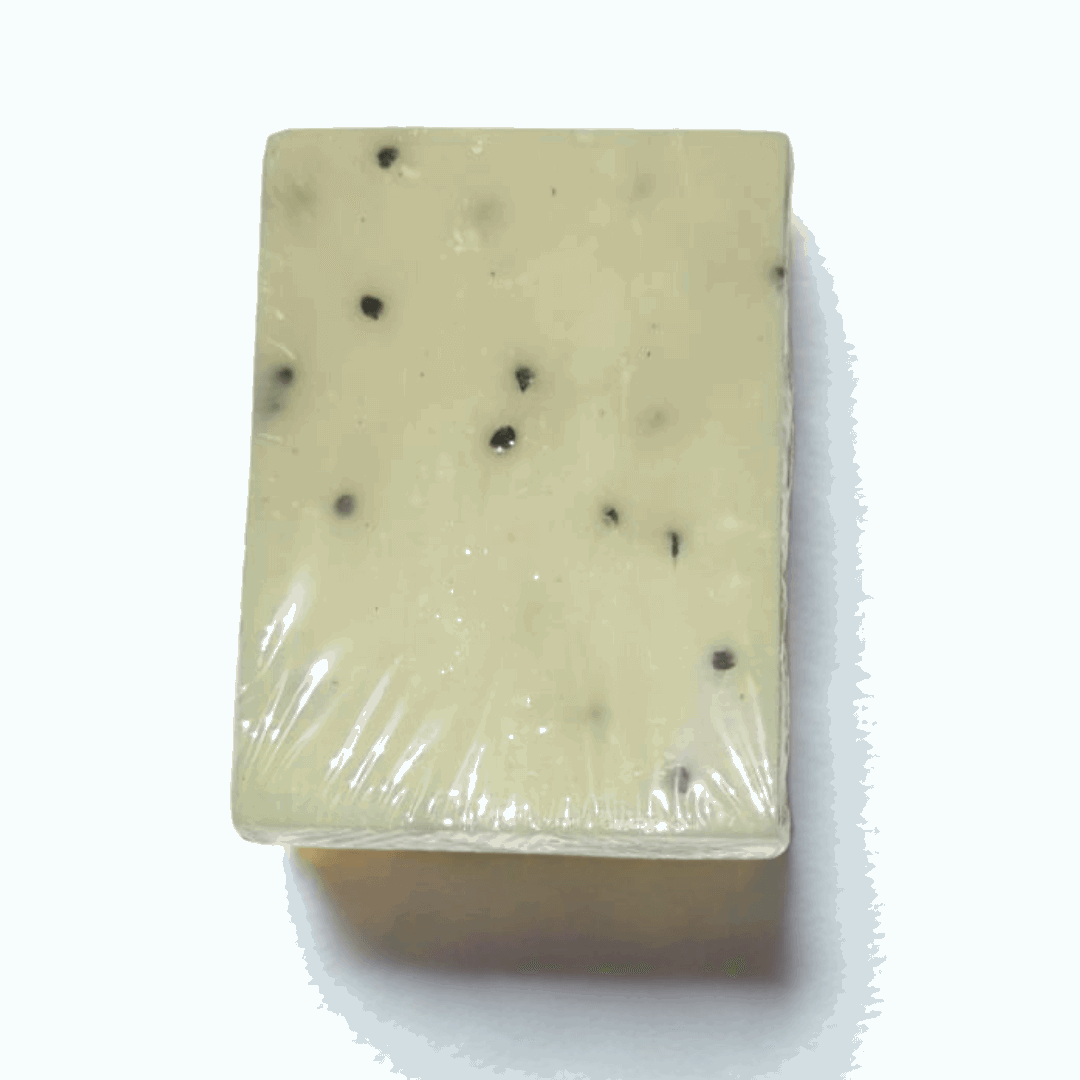Rectangular bar of soap with black specks Natural Vitamin E Soap |on a white background