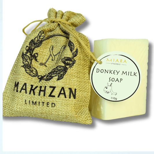 Natural Donkey milk soap UAE with a yellow drawstring bag labeled 'Makhzan Limited' on a white background