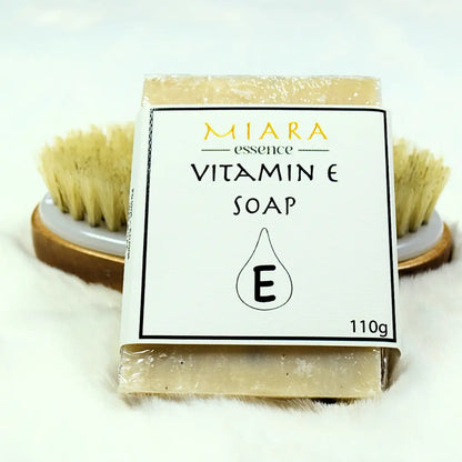 MIARA Essence Vitamin E soap bar with packaging on a white background